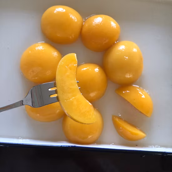 Консервированные фрукты Консервированный желтый персик в легком/густом сиропе